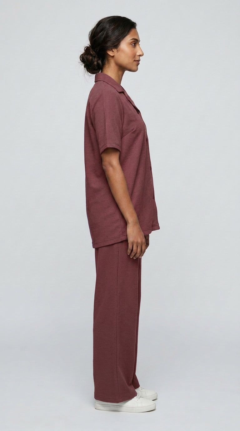 AT7X Berry Mauve sleepwear co-ord set, side view showing loose wide leg trouser and shirt hem