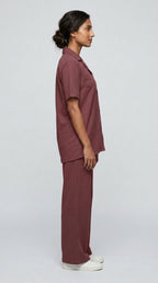 AT7X Berry Mauve sleepwear co-ord set, side view showing loose wide leg trouser and shirt hem