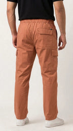 AT7X earthy warm loose fit cargo trouser for men, back view showing single rear pocket
