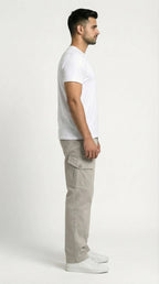 AT7X beige loose fit cargo pants for men, full length styled view