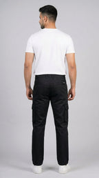 AT7X black straight fit cargo pants for men, full length styled view